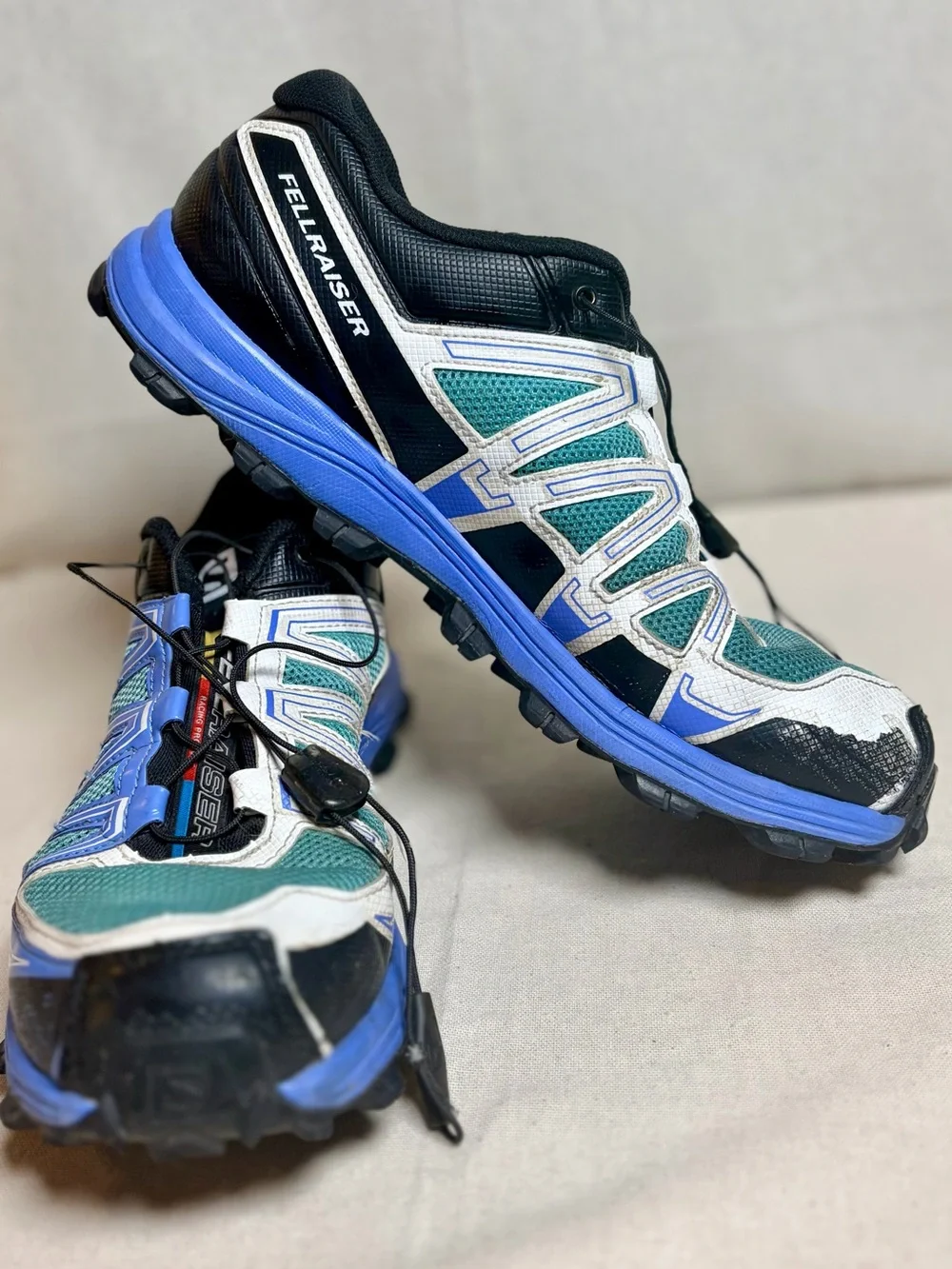 Salomon woman’s Sneakers in Teal, Blue, White and Black size 10